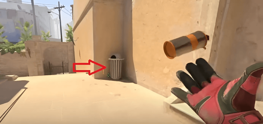 cs2, a smoke grenade, a hand
